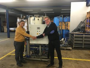 Director Peter Bulsing (right on top photo) of Dutch Water Partners (DWP) presented the first unit to technical manager Mahendra Misra (left) of WaterHealth who recently visited the production location in Leeuwarden, the Netherlands.